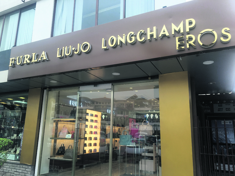 Luxury handbag store opens today